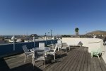 The rooftop deck is wind protected and features amazing ocean views